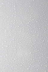 drops of water on a white surface