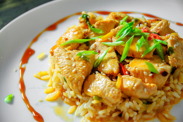 Chicken Breast with Rice in plate on a wooden background