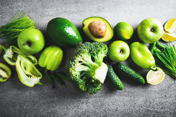 Fresh fruit, vegetable, greens on gray concrete background. Green healthy food, clean eating. Detox, dieting food.	