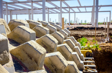 Road roller with spikes is working at construction site