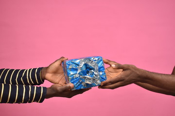 someone giving a gift to someone