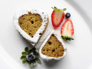 two heart-shaped pies on a white plate