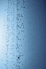 Falling water drops in frozen motion.