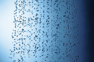 Falling water drops in frozen motion.