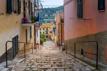 Fototapeta premium Old town downhill street of Santo Stefano, Toscana, Italy