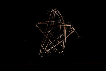 Star made with Sparklers on a Black Background