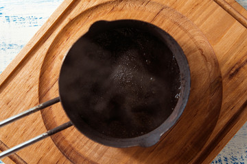 Freshly made black coffee in Turk.