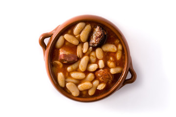 Typical Spanish fabada asturiana isolated on white background.	Top view