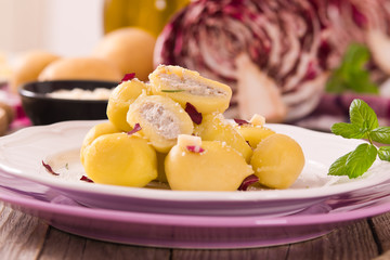 Potato gnocchi stuffed with radicchio and ricotta.
