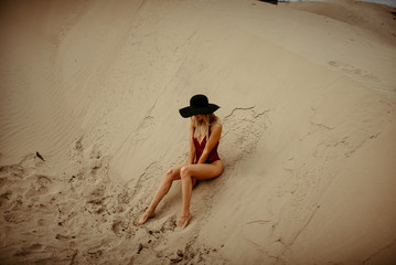 Woman with fit body portrait in desert