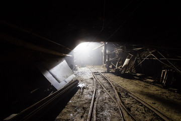 Naklejka premium Underground gold mine tunnel waith light