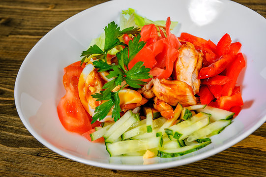 Teriyaki Chicken Salad On A Wooden Background.