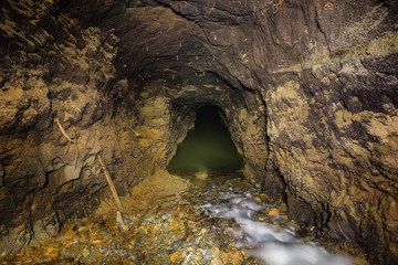 Underground gold mine settler pond waterfall