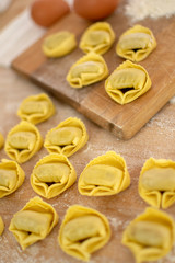 Obraz na płótnie Canvas Traditional Italian pasta. Preparation homemade pasta tortellini with spinach and ricotta.