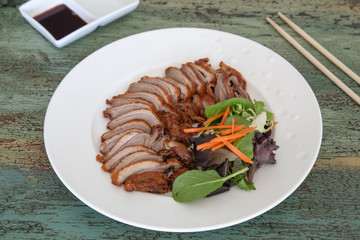 Roasted duck with soy sauce on vintage wooden background, Thai food, Chinese food