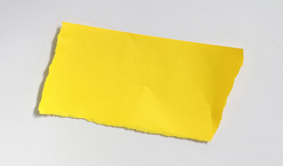 yellow ripped paper on white background
