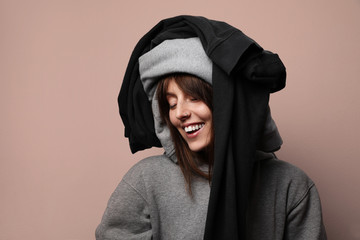 Close-up portrait of a young woman wearing a clothing on her head. Global consumption concept.