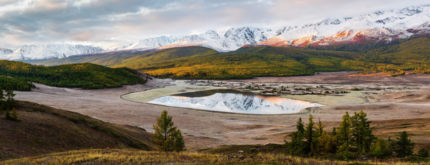 Panorama of the North Chuysky ridge and lake Dzhangyskol at dawn. Russia, Altai Republic, Yeshtykol tract