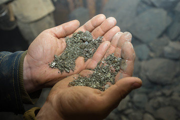 Gold ore pyrite specimen in miners hand