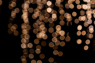 Bokeh of the orange light in the garden at night. Blurred of the yellow light in the Karchart festival at Bangkok ,Thailand. Can use for add text and abstract background.