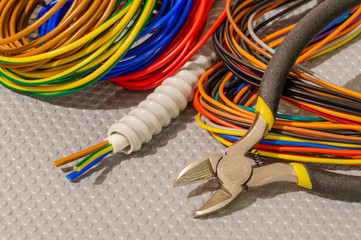 Many wires different color and tool for electrical repair