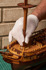 Installation of the foremast on the ship model. Assembly of ship model from wood