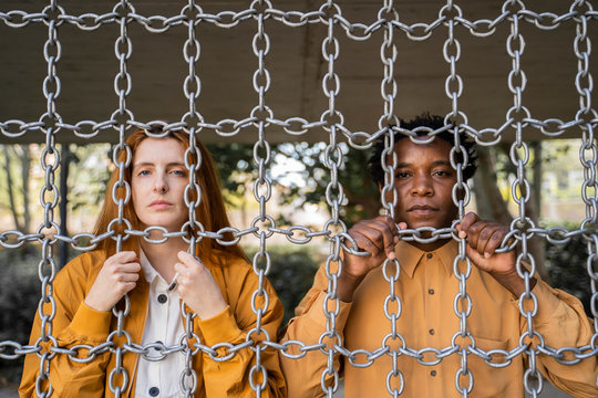 Couple behind chains