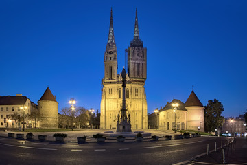 Zagreb, Croatia. Cathedral and Kaptol square with fountain of Blessed Virgin Mary in twilight.