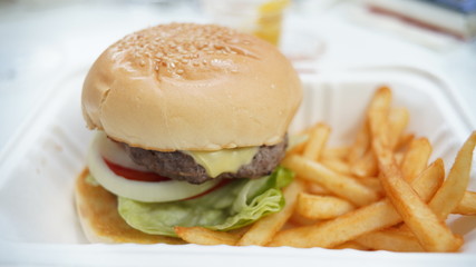 Meat burger and french fried in white package