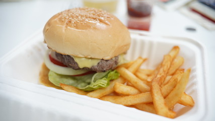 Meat burger and french fried in white package