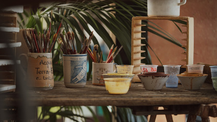 Craftsman decorates handmade terracotta