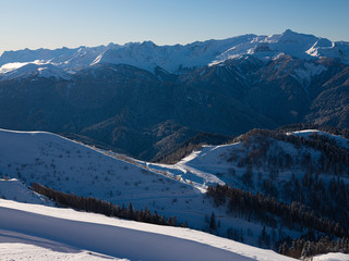Fototapeta na wymiar Mountain peaks of the Caucasus at Krasnaya Polyana, the village Rosa Khutor, winter sports resort of Sochi, Krasnodar Krai, Russia