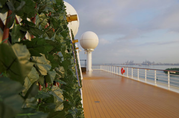 Outdoor terrace or patio with lounge seating and furniture and sun loungers on deck of luxury...