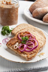 Slices of bread slathered with pork lard mixed with ground cracklings