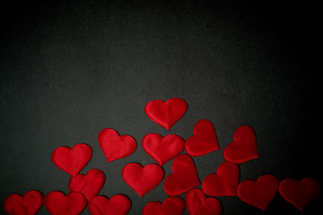 Valentine's day, a Declaration of love. Lots of red hearts on a dark graphite background.