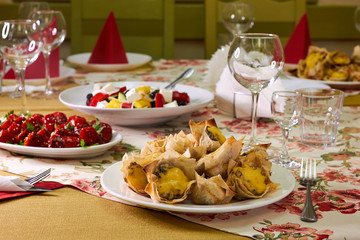 Baskets puff pastry baskets filled with cheese, mushrooms and egg on plate