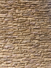 Classic Random Light brown brick arranged on the wall for decorate exterior of building.