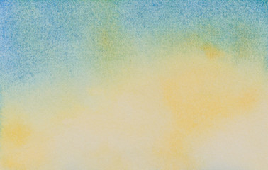 Watercolor abstract blue and yellow sky background. Hand drawn watercolor painting..