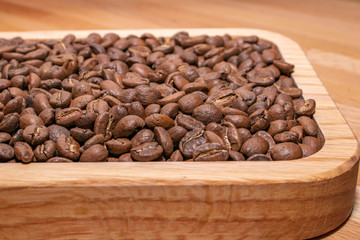Coffee beans in a wooden box.