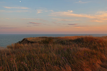 sunset on coast of sea