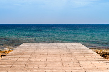 empty wooden pier with sea view