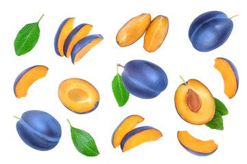fresh blue plum and half with leaves isolated on white background. Top view. Flat lay