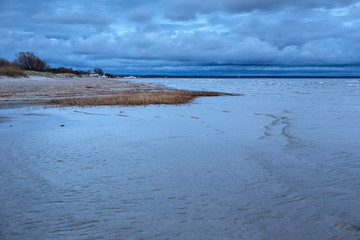 Coast of the Parnu Bay in evening in overcast whether. It a bay in the northeastern part of the...