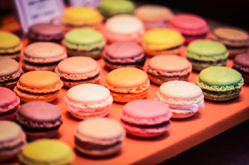 mix french macaroons close up view with different flavours & colours