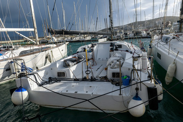 White motor yacht moored in marina at day time
