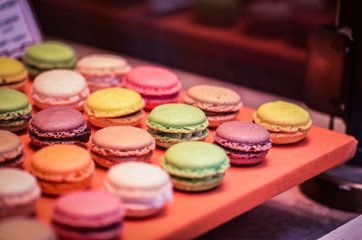 mix french macaroons close up view with different flavours & colours