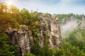 Bastei, Germany: Beautiful landscape with bastey rocks in the national Park Saxon Switzerland. Fog in the mountains