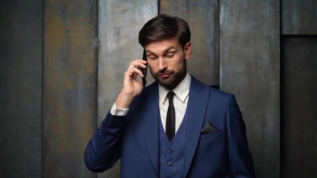 full hd video of young handsome stylish businessman - 4x slow motion - using smartphone