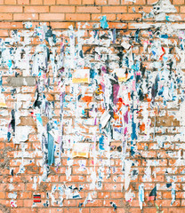 Brick wall with the remains of old advertisements