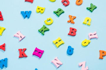 Multicolored letters on a blue background.